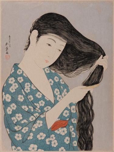 髪梳ける女