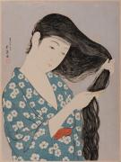 髪梳ける女
